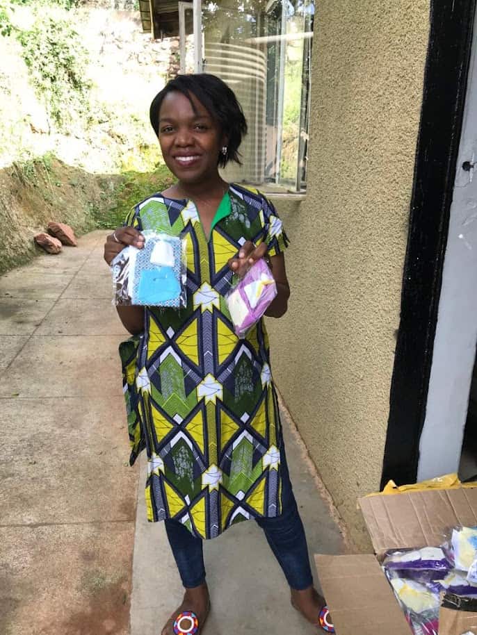 Stacy holding several "Loss gifts"